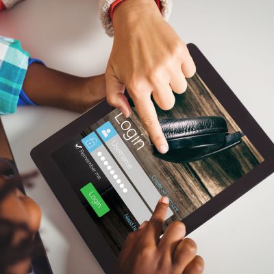 Digital composite of Top view of  hand pointing at tablet screen
